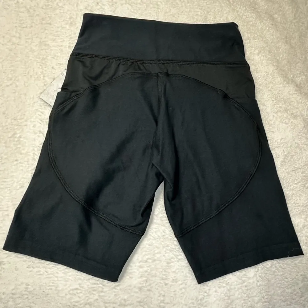 UFC Women's Black Bike Shorts with Red Logo and Side Pockets Size M - Image 7