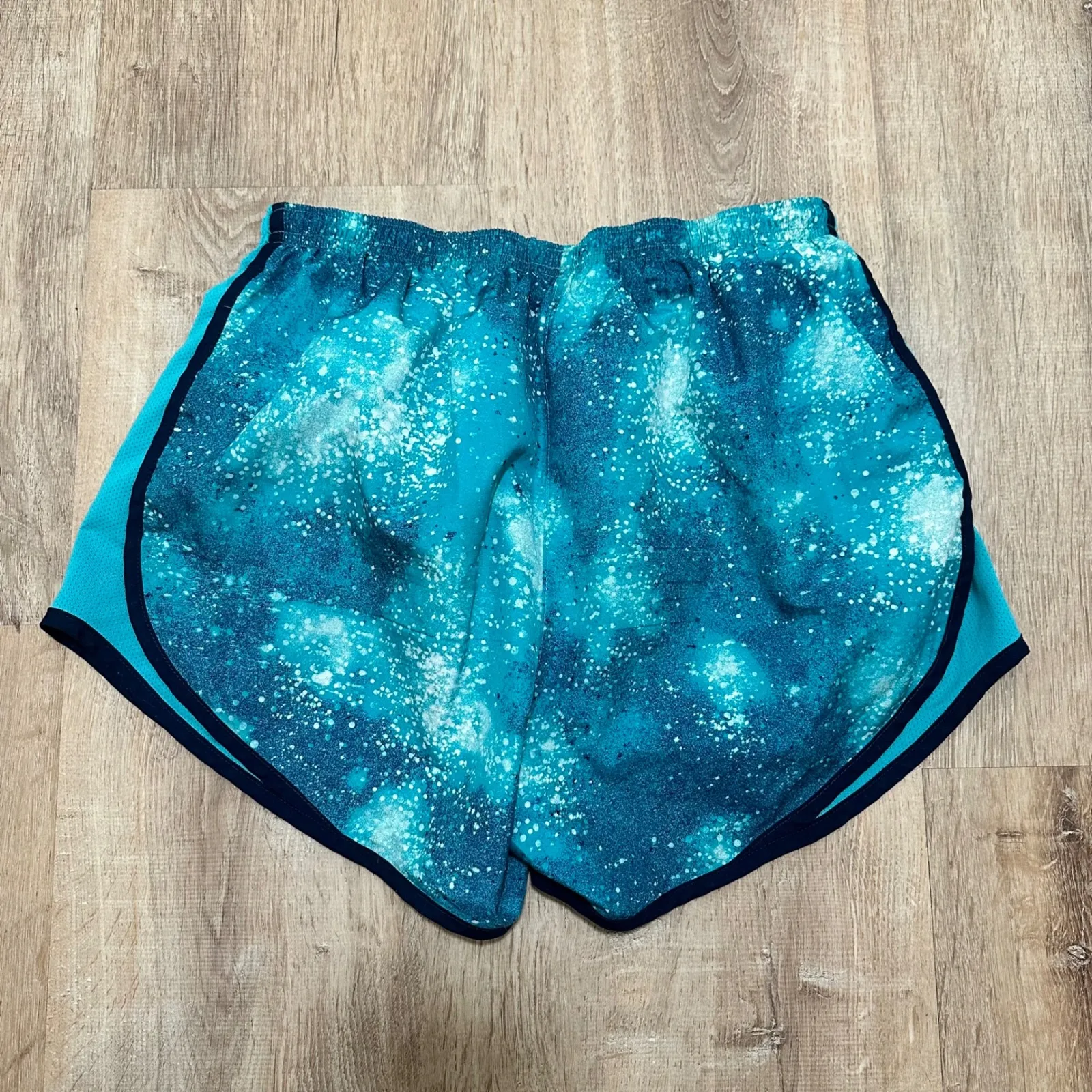 NIKE | Women's Dri-FIT Teal Navy Galaxy Print Athletic Running Shorts - Image 2