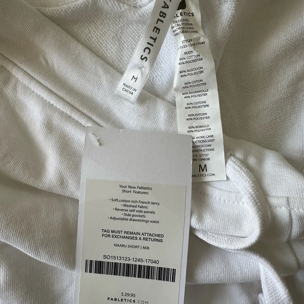 NWT Fabletics Women's Naaru White/Orange Terry Cotton Dolphin Hem Shorts Size M - Image 2