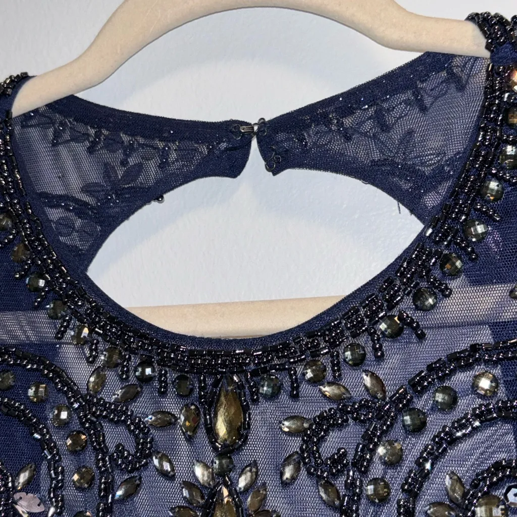 Xscape Beaded Open-Back
Mermaid Halter Royal Blue Gown - Image 6