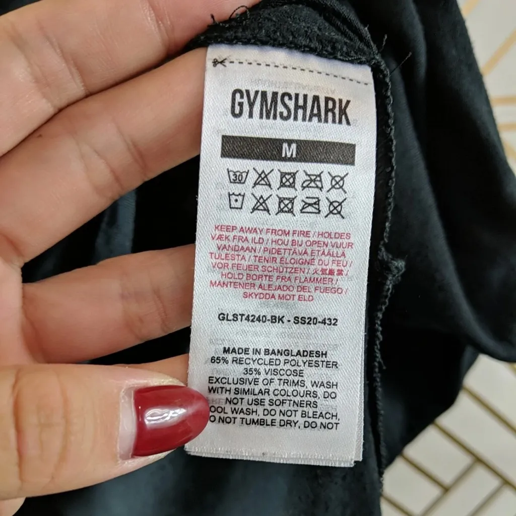 Gymshark Women's Black Short Sleeve Asymmetrical Slit Top Size Medium - Image 6