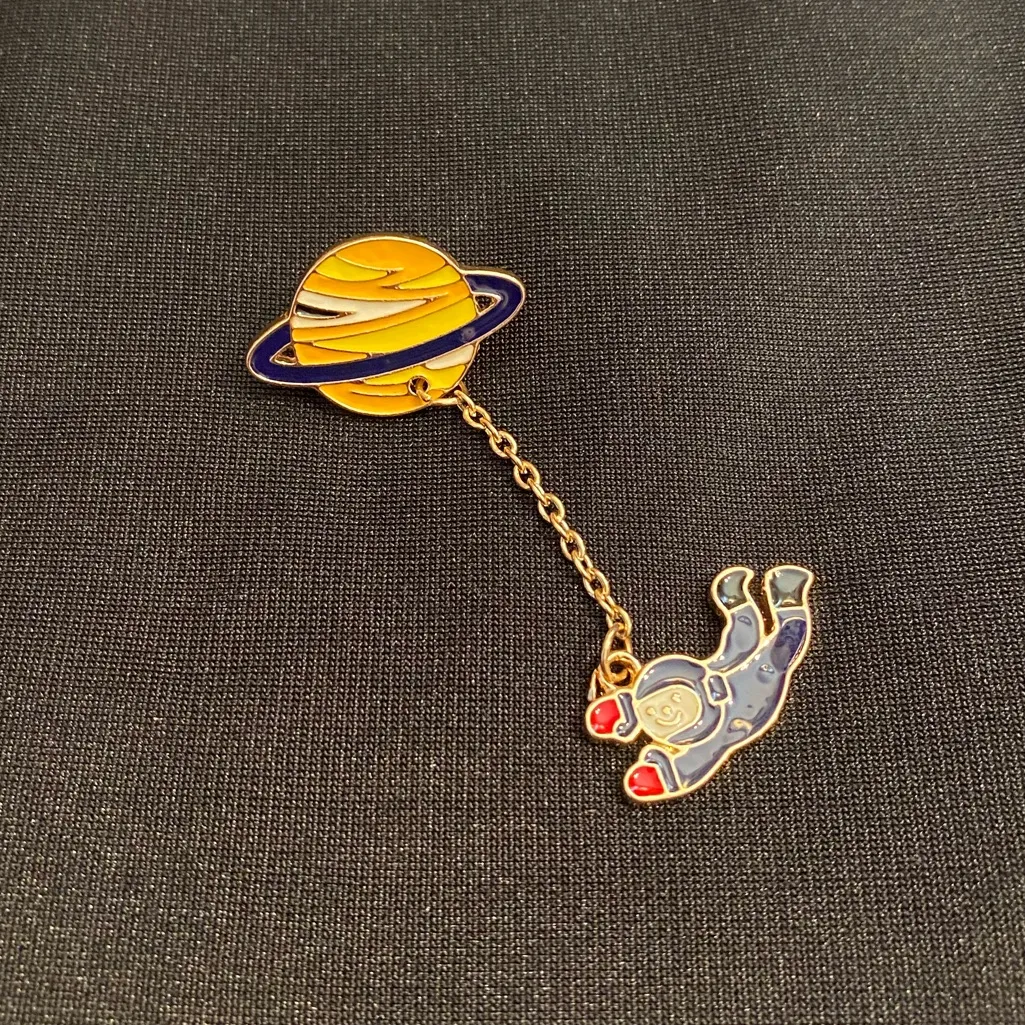 Junior Astronaut goes on their first spacewalk on this enamel pin/magnet. Blue - Image 3