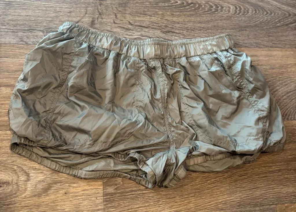 Free People Movement Sunshine Bubble Hem Shorts Light Olive Active Athleisure - Image 1