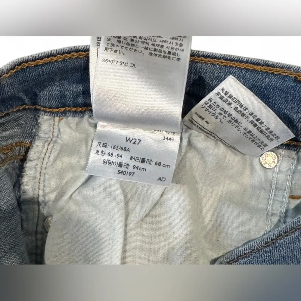 Levi's Blue Jean Shorts with Distressed Hem and Butterfly Accents - Image 3