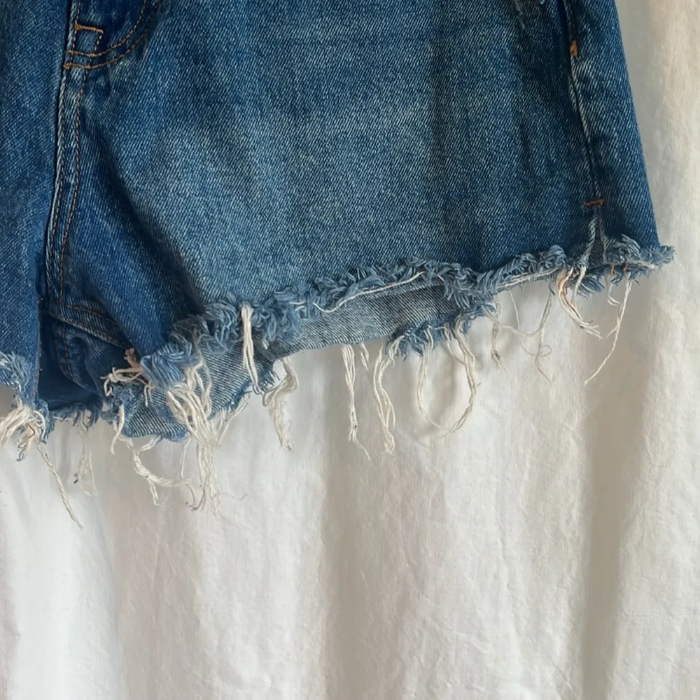 The High Waist Short Cut Off Fraying Medium Wash Denim Jean Shorts - Image 3