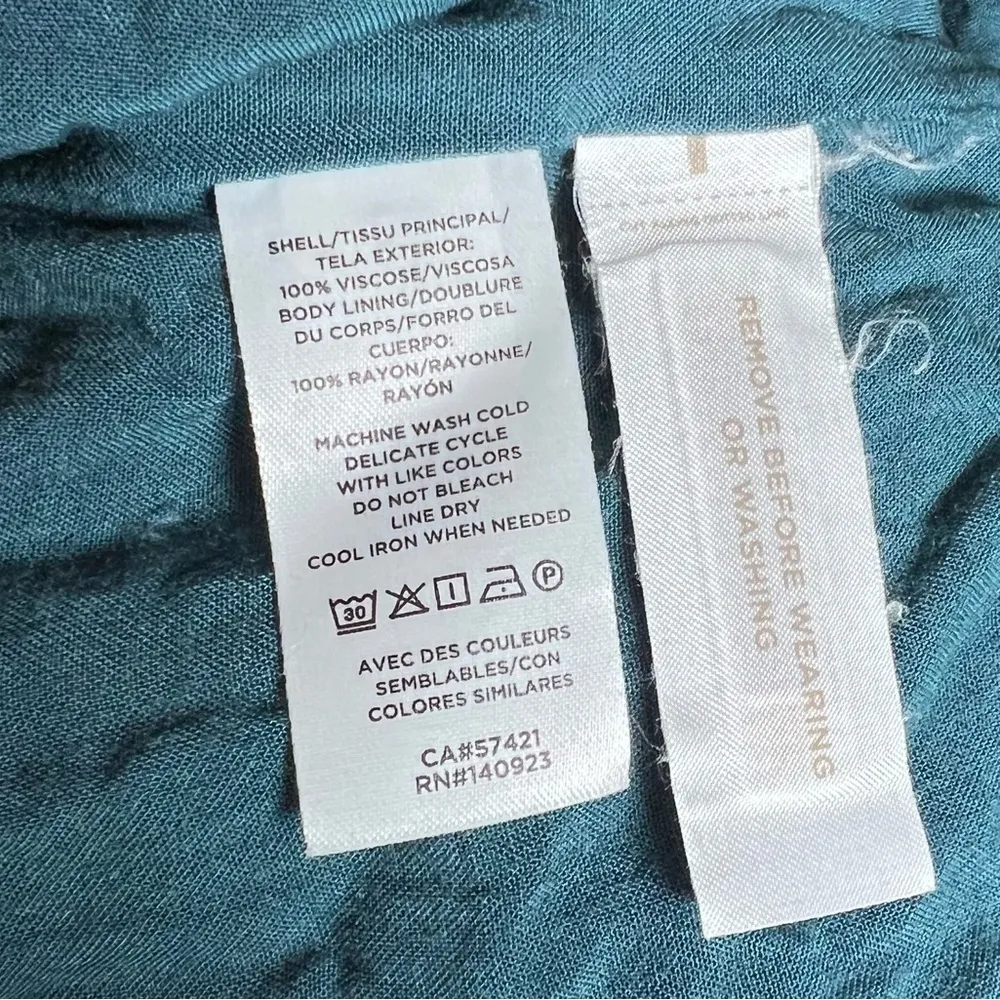 teal green Swiss dot romper with pockets size large - Image 9