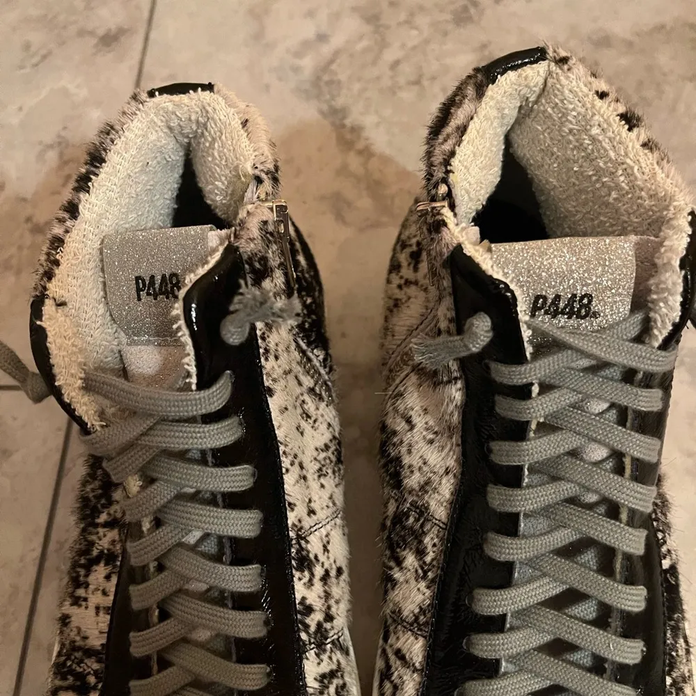 Star High Top Faux Fur Platform Sneakers in Cowprint - Image 13