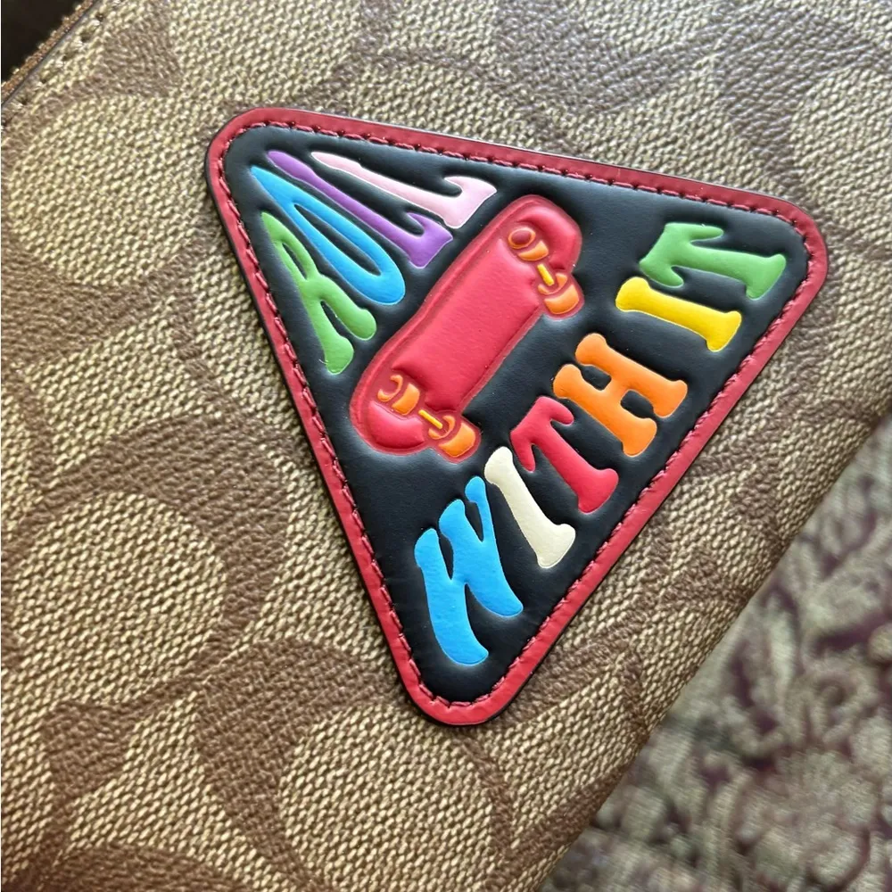 Authentic COACH Signature coated canvas/leather "Roll with it" zip wristlet - Image 9