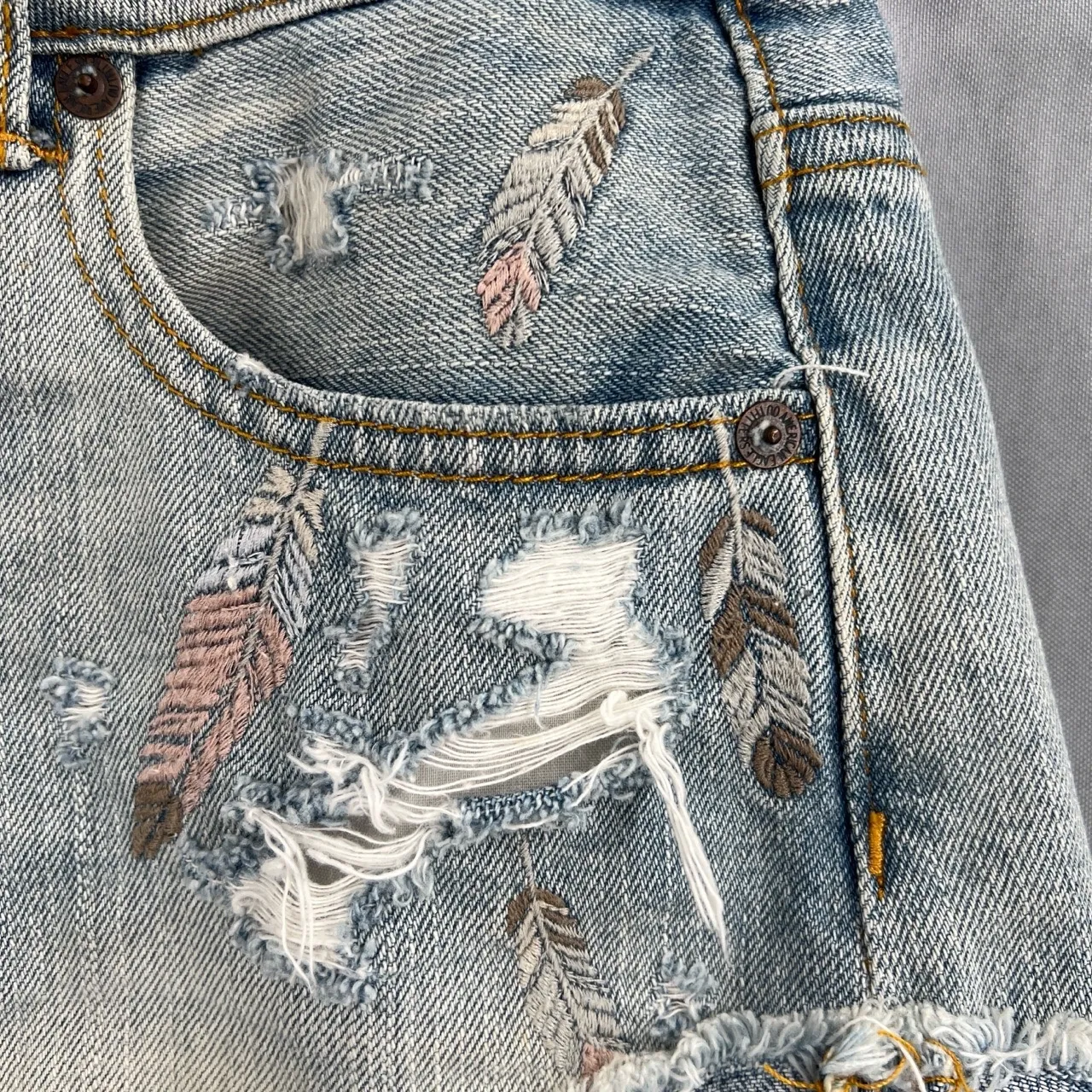 AEO Jean Short Blue Distressed Embroidered Feathers Hem Hi-Rise Festival Size 2 - Image 3
