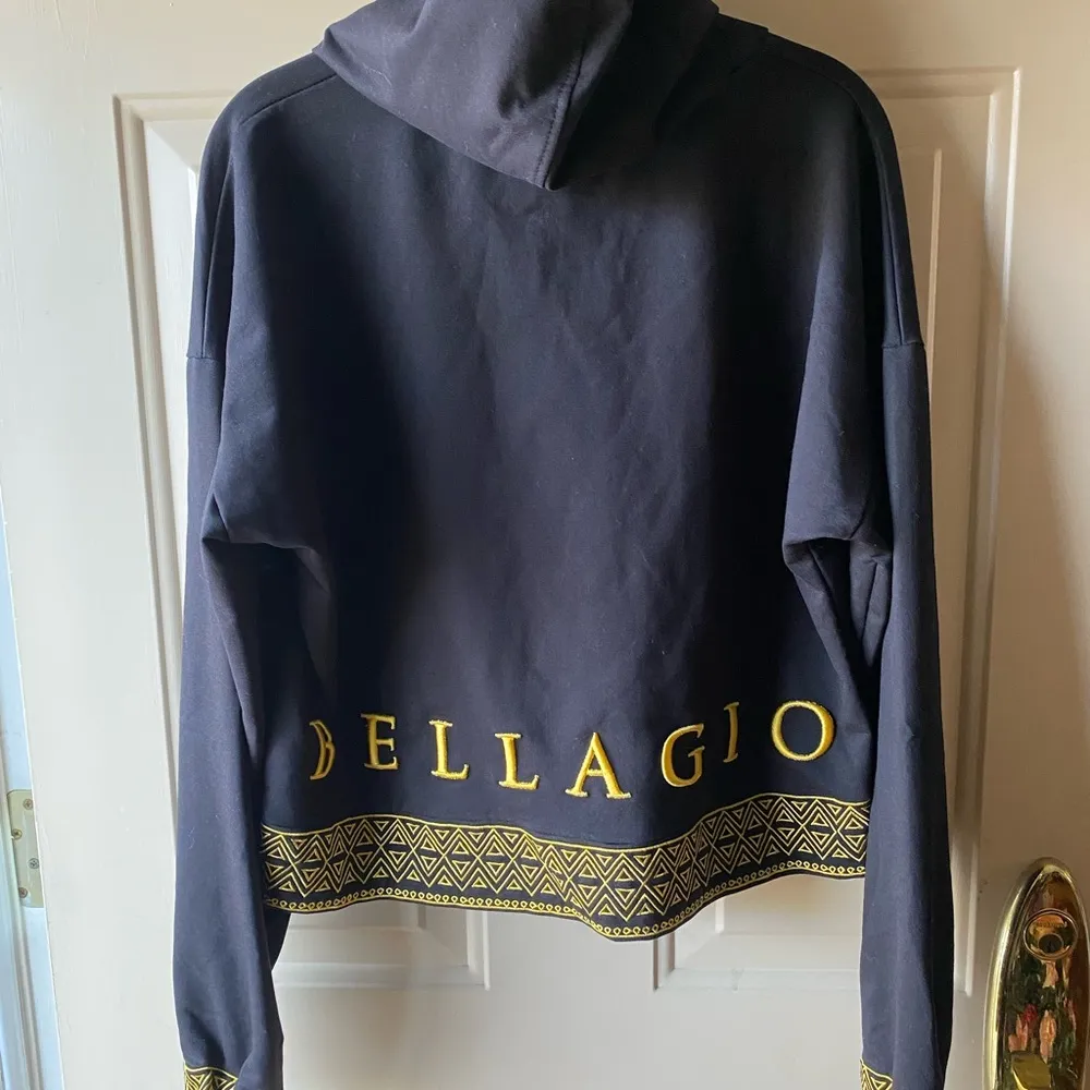 Gold and Black Pullover Hoodie with Decorative Band - Image 2