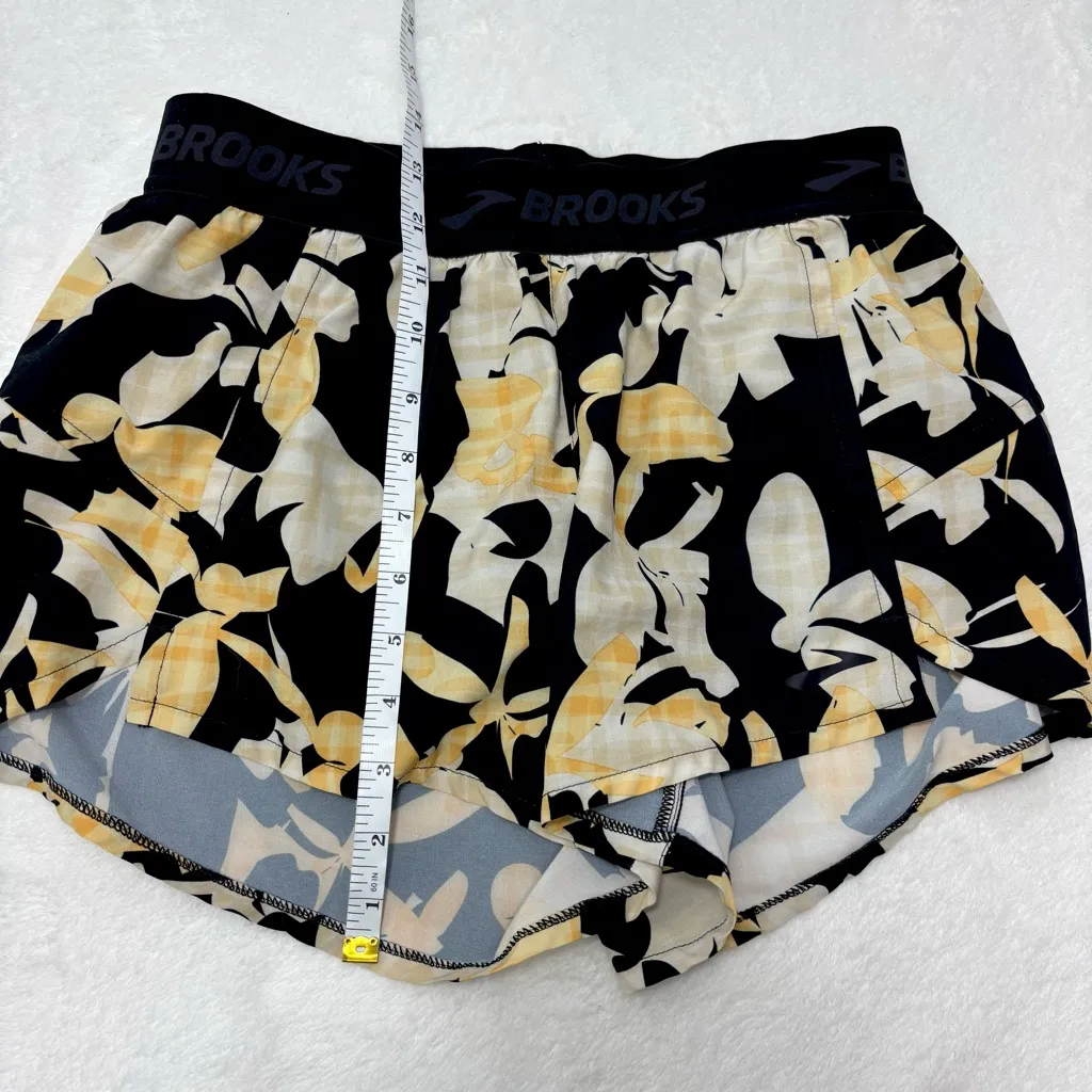 Brooks Women's Athletic Shorts with Black and Yellow Floral Pattern size S - Image 5