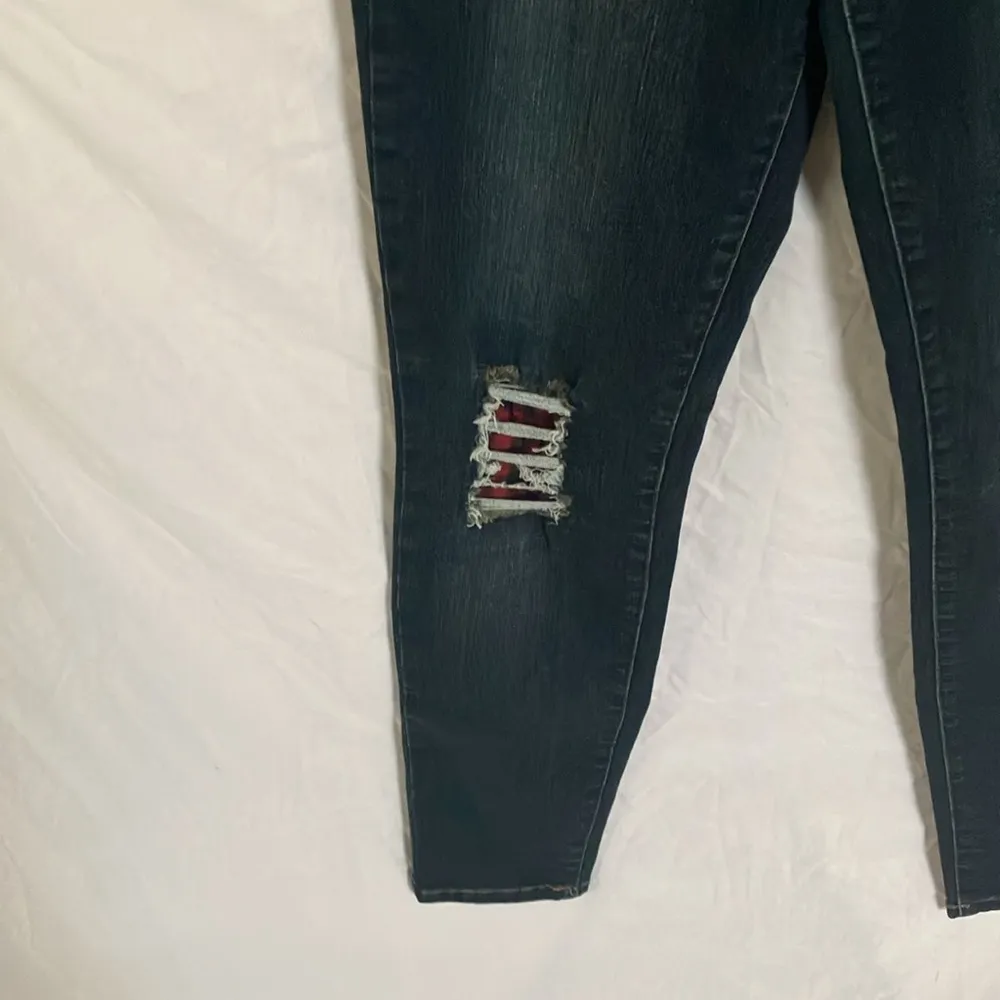 Tractr: Stretchy Skinny Jeans with red flannel covered holes - Image 6