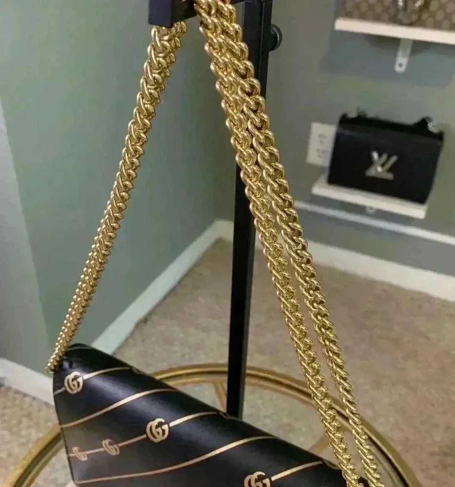 Gucci mini leather chain bag with double G stripe in black and gold. - Image 4