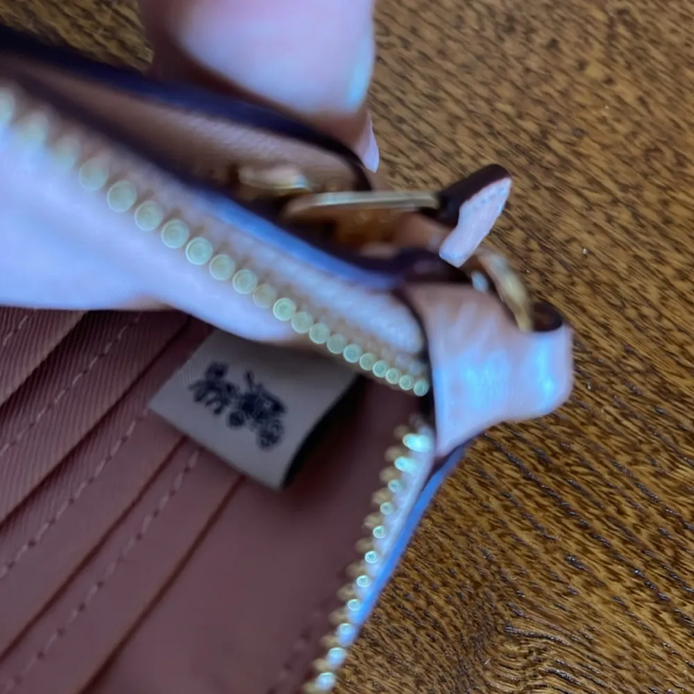 Coach  dual pocket wallet monogrammed front with a pebbled, leather backside - Image 7