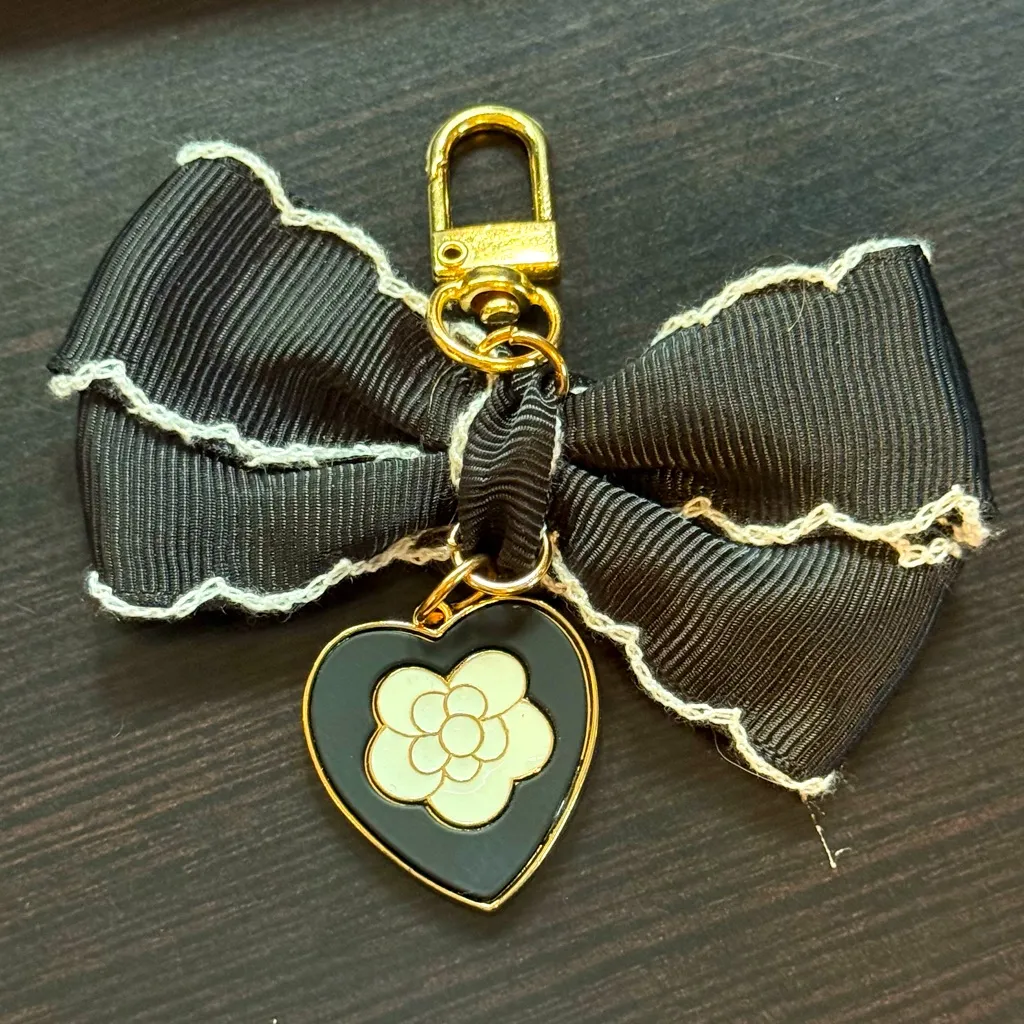 Black and White Enamel Camellia and Ribbon Bow Gold Bag Charm Keychain - Image 2