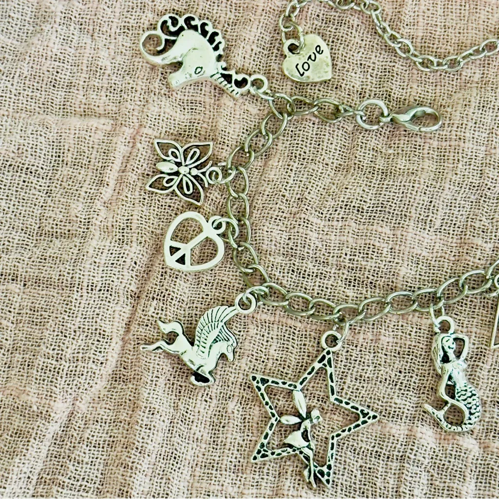 Silver Charm Bracelet with Various Charms - Image 2