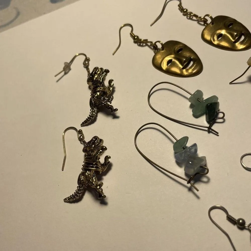Lot Of 5 Dangle Costume Earrings Pierced Mix Dinosaur / Drama Mask / Planet - Image 4