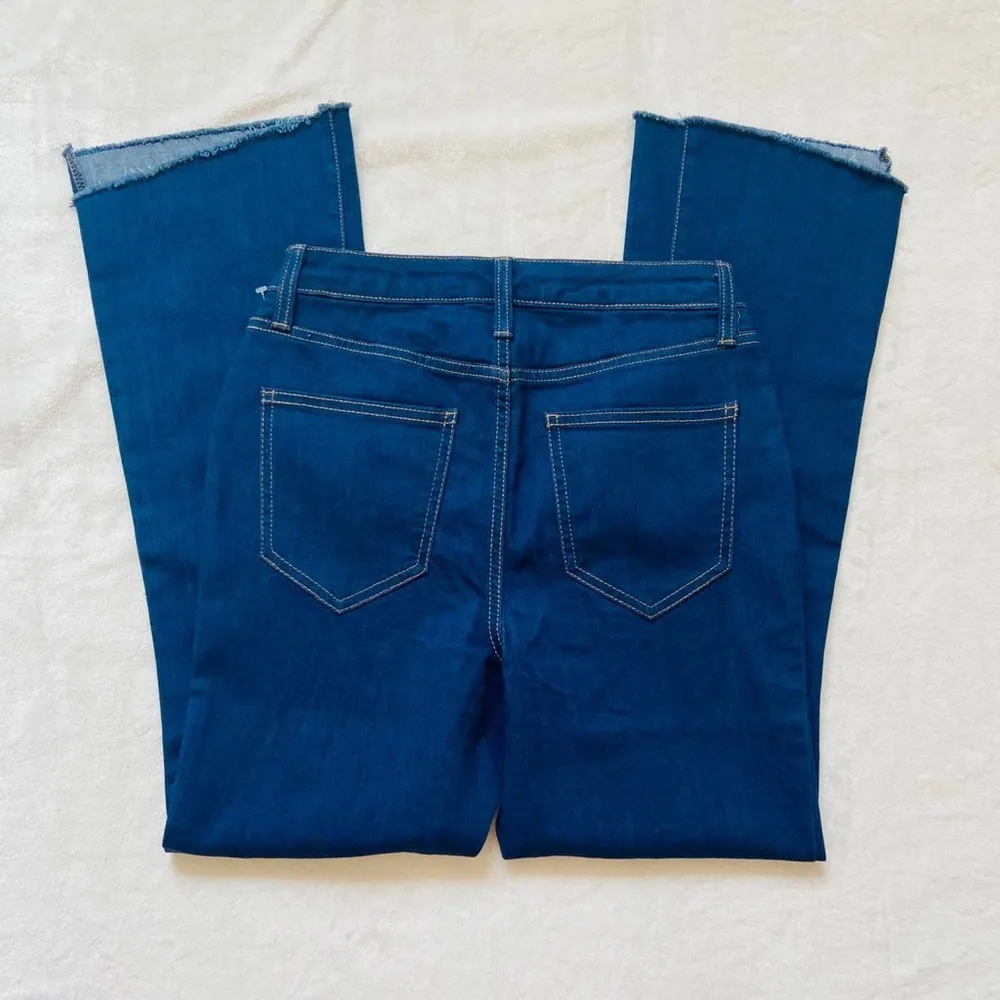 Nine West mid rise dark wash kick flare jeans with frayed bottom pant legs - Image 4