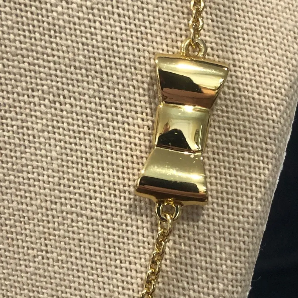 KATE SPADE Gold Tone Gold Enamel Bow Long Necklace - Image 11