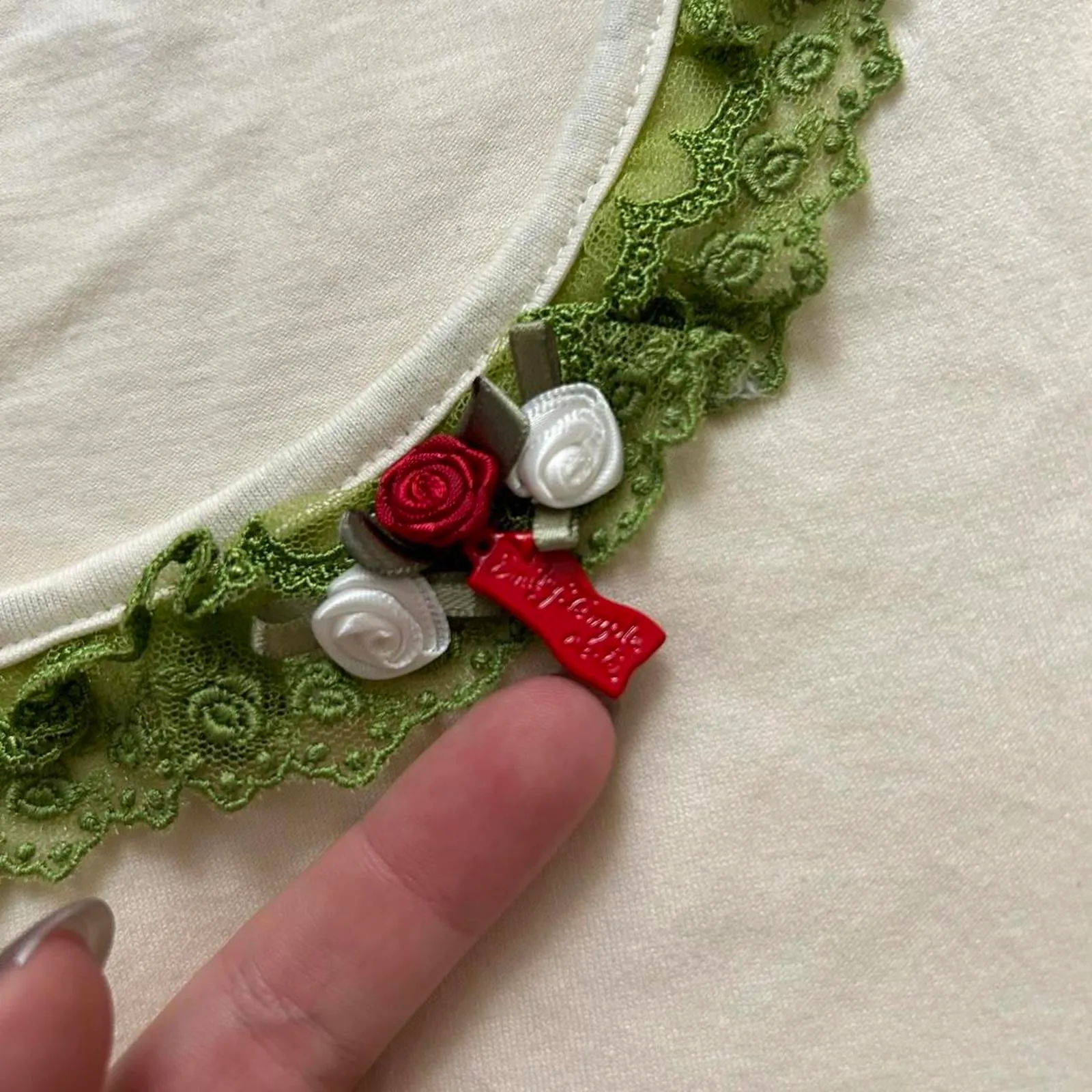Emily Temple Cute Cream and green lace trim top with red charm detail - Image 3