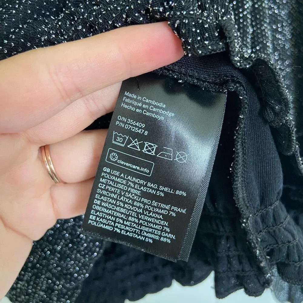 Divided H&M women’s sparkly black off shoulder‎ blouse — medium - Image 4