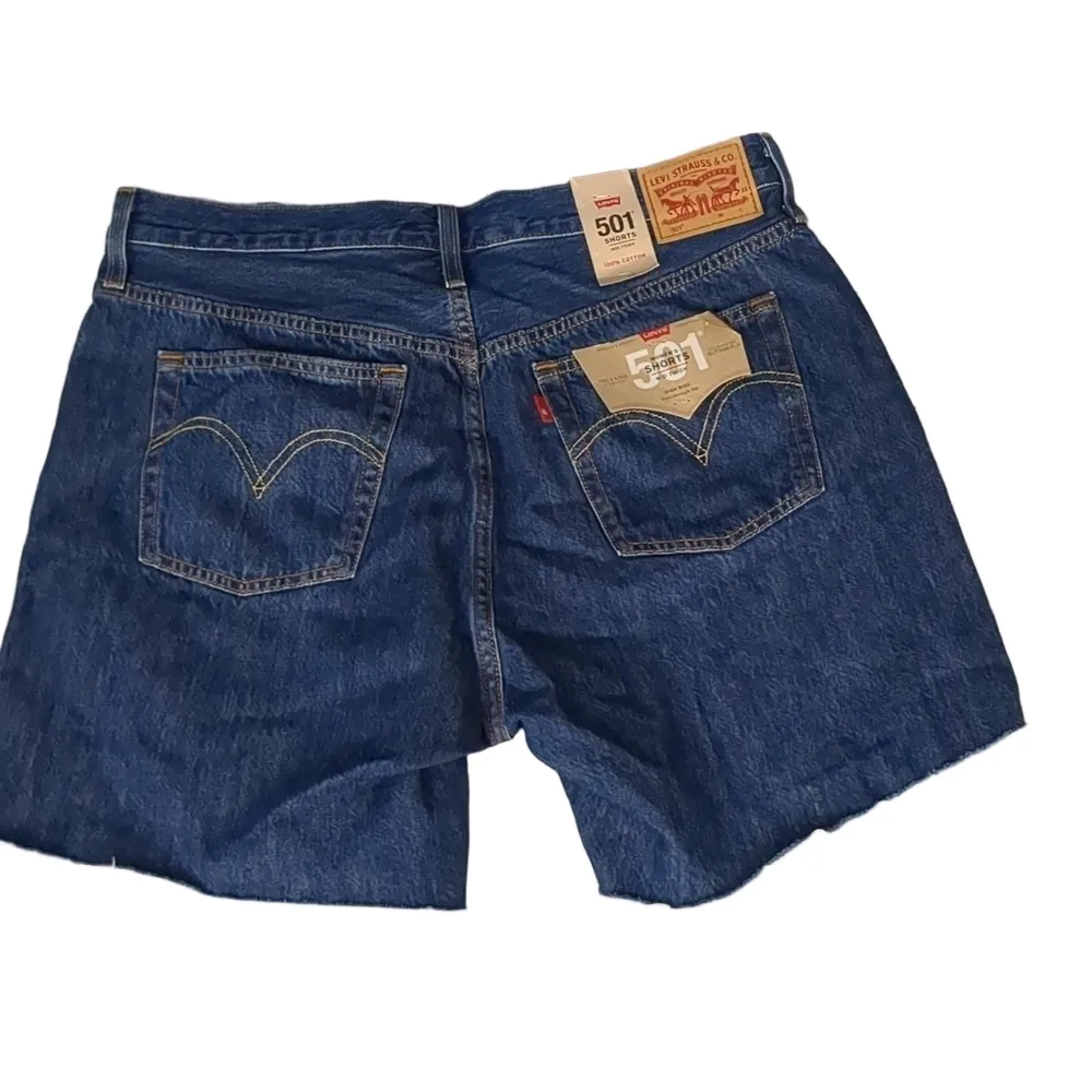 Levi's mid thigh high rise raw hem jean shorts size 33 - Image 7