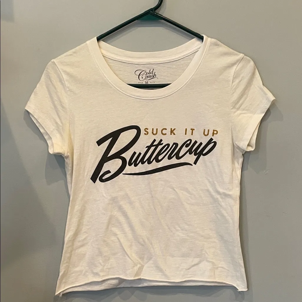 White Tee with Blue and Gold Print saying suck it up buttercup - Image 1