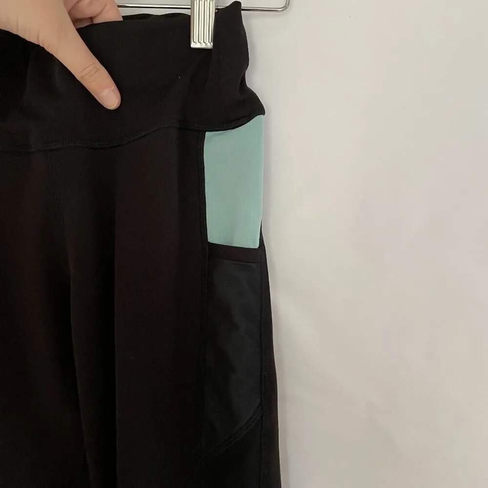 PopFit High-Waisted Black and Green Leggings With Side Pockets & Mesh Panels - Image 2