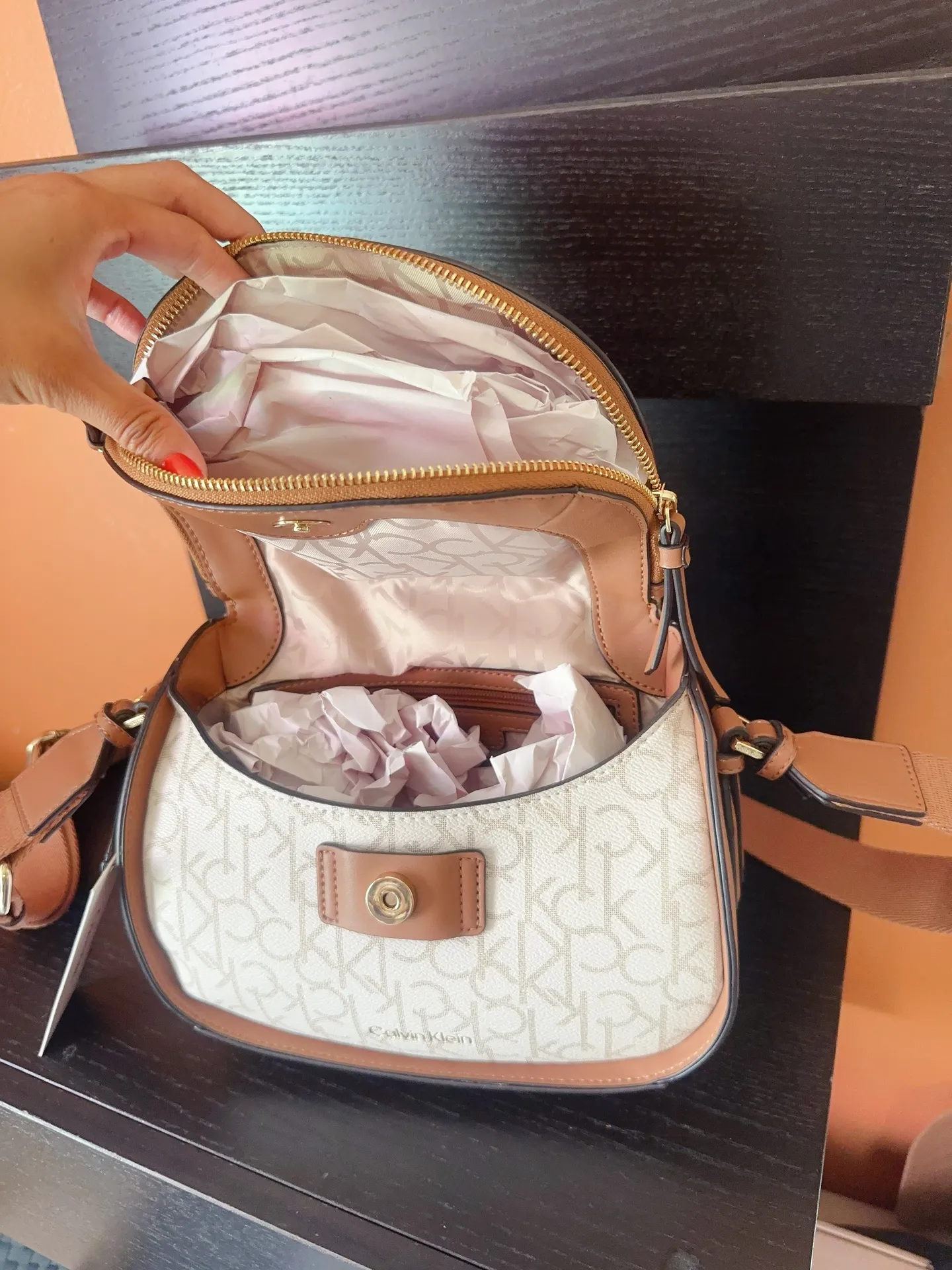 unique flap camera bag brown vanilla wide soft strap crossbody NWT   This  crossbody bag is the perfect addition to any outfit. The bag features a unique flap closure with a zipper, magnetic, and snap closure options to ensure the safety of your belongings. The vanilla exterior leather material is accented with a strap accent, zipper, and flap closer, making it both stylish and functional.   The bag has a medium size with a width of 11 inches, a height of 8 inches, and a depth of 5 inches. The hardware color is gold, while the handle/strap color is brown, adding a nice contrast to the bag. The bag also comes with an adjustable strap, making it easy to wear across the body. The interior features credit card slots, inner and outer pockets, organizers, and inner dividers, as well as a mobile phone pocket. The bag also comes with a brand card, and its product line is STYLE H4AEJEW4.  New in box with tag  Same day shipping  Smoke and pets free   Don’t forget to bundle In My Store - Image 7