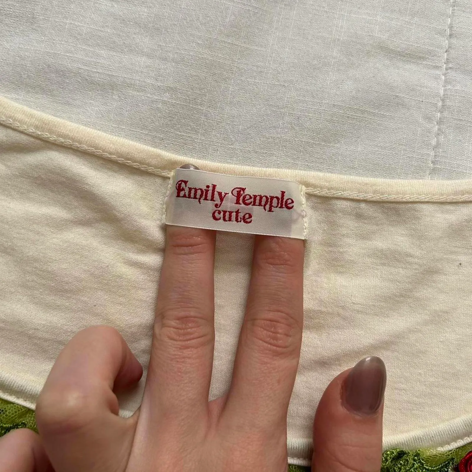 Emily Temple Cute Cream and green lace trim top with red charm detail - Image 2