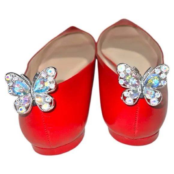 Pretty silver sparkly iridescent butterfly show clips. These are plastic. Size undefined - Image 2