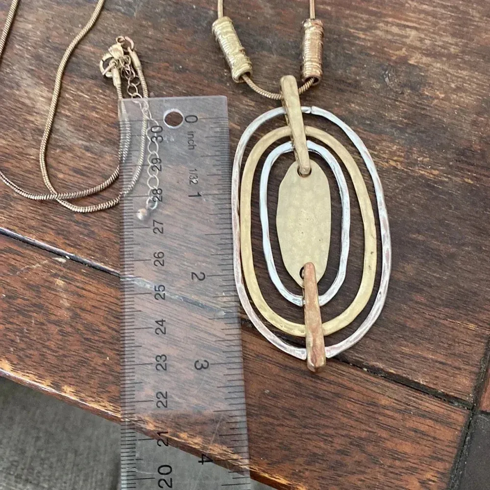 Statement gold and silver tone pendant necklace - Image 2