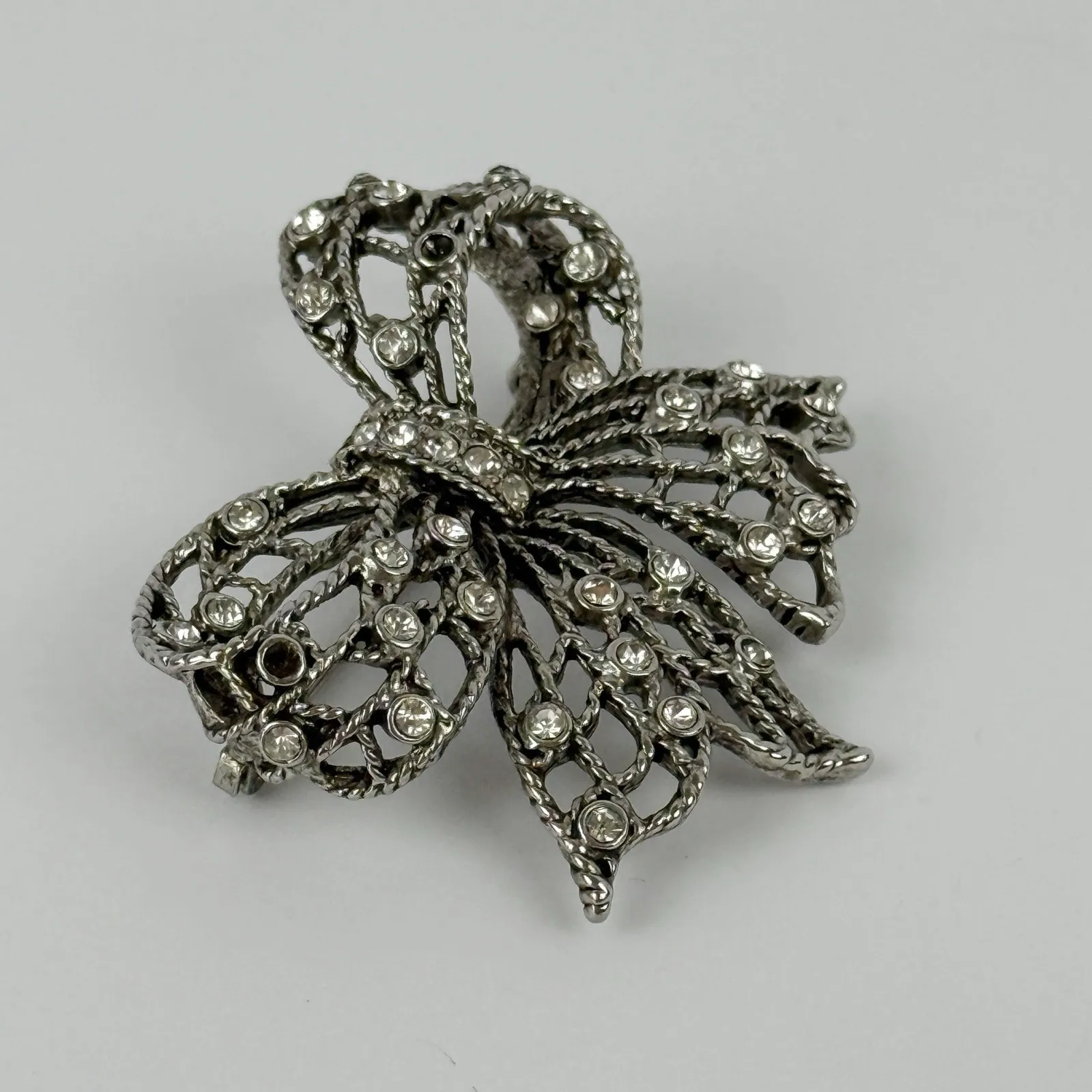 Vintage Silver Tone Rhinestone Bow Brooch Openwork Ribbon Statement Pin - Image 2