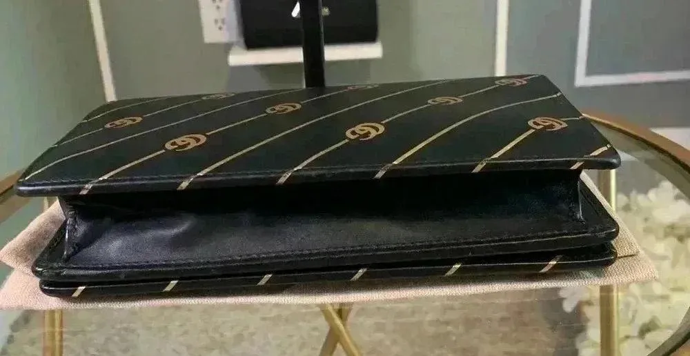 Gucci mini leather chain bag with double G stripe in black and gold. - Image 7