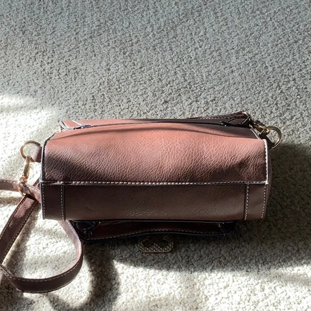 Go with every thing purse in brown with unique front latch and removable strap. - Image 10