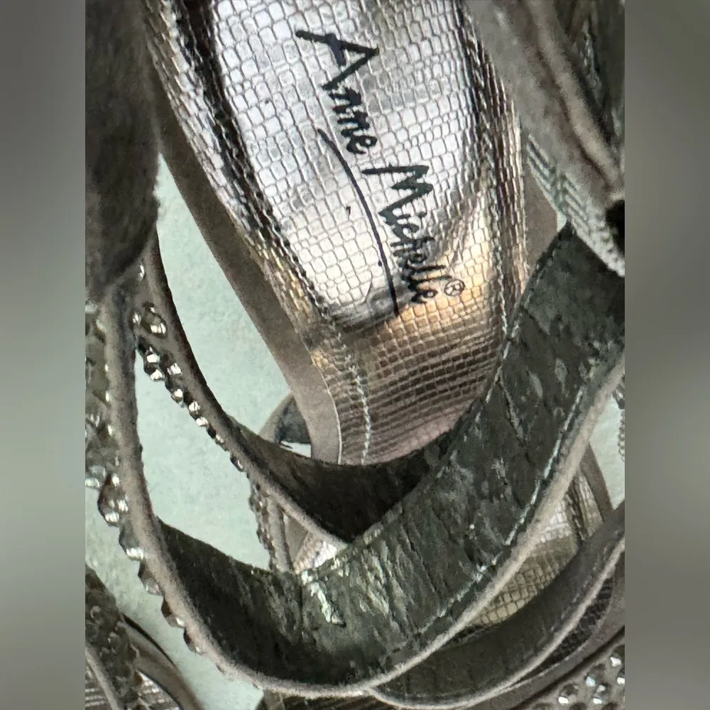 Grey heels with stone details on the straps and adjustable ankle closure. - Image 6