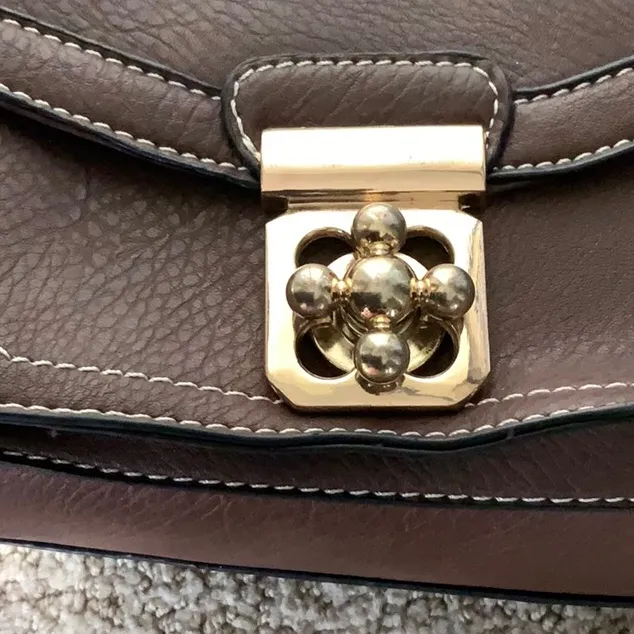 Go with every thing purse in brown with unique front latch and removable strap. - Image 5