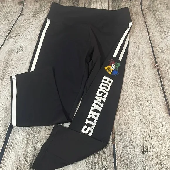 Women’s Harry Potter Hogwarts black w/white side stripes leggings Small - Image 1
