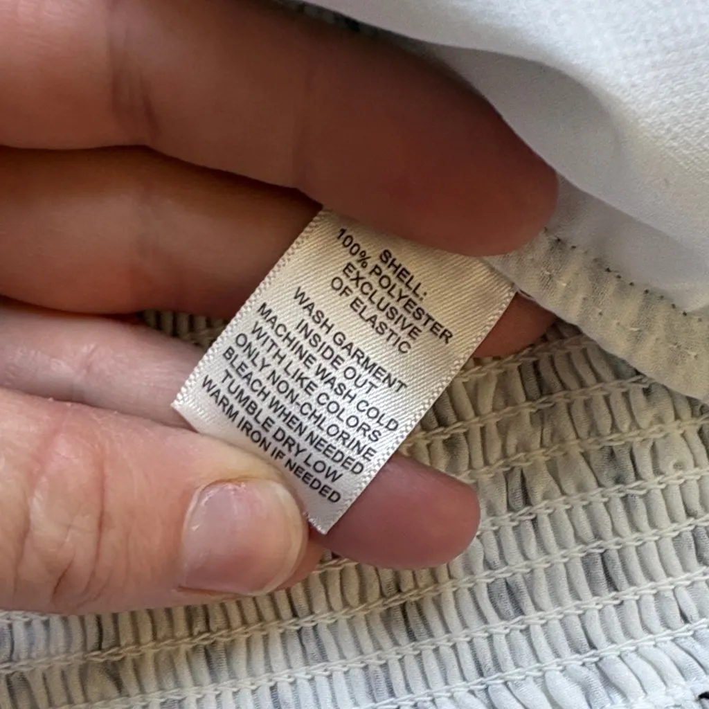 White House Black Market Sleeveless Blouse with Diamond Print and Ruffle Detail. - Image 10