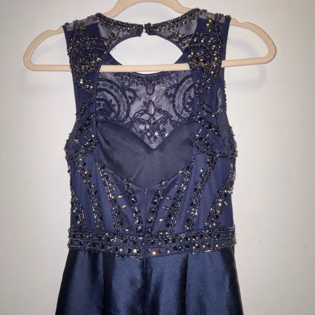 Xscape Beaded Open-Back
Mermaid Halter Royal Blue Gown - Image 8