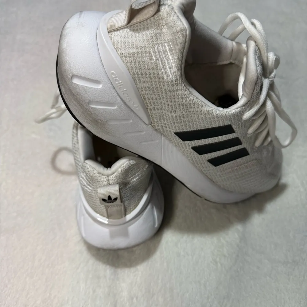 Adidas White and Black Athletic Shoes with Breathable Fabric and Cushioned Sole - Image 4