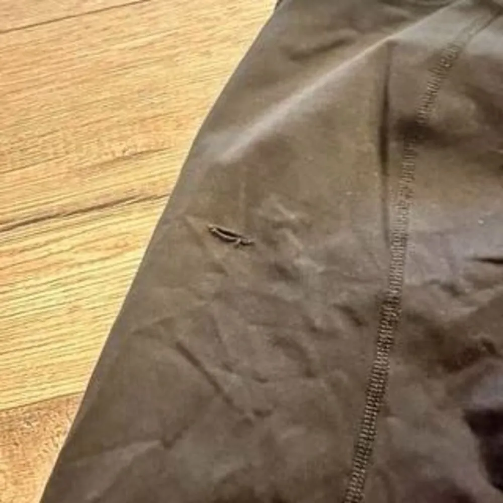 Black Lululemon cropped leggings w/ white detail size 6 (small rip) - Image 2