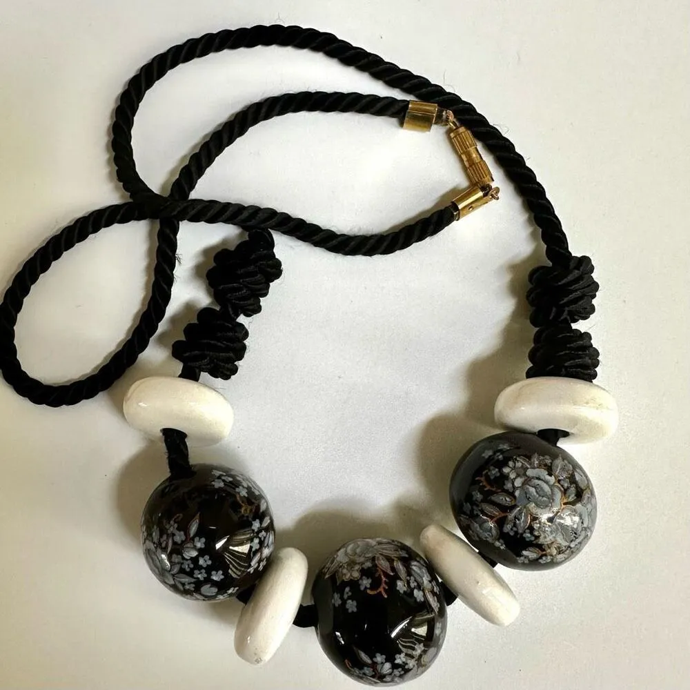 Black floral and white beaded necklace on black cord - Image 3