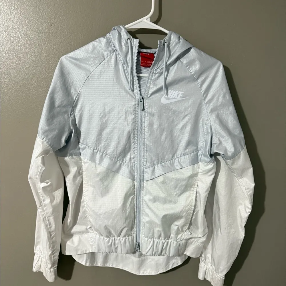 Nike Blue and White Raincoat with Hood and Water-Resistant Fabric - Image 1