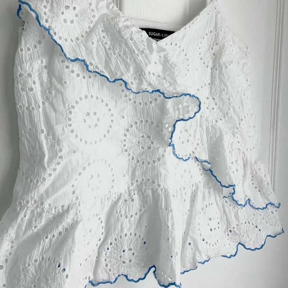 Sugarlips Eyelet White Peplum Blouse - Image 2