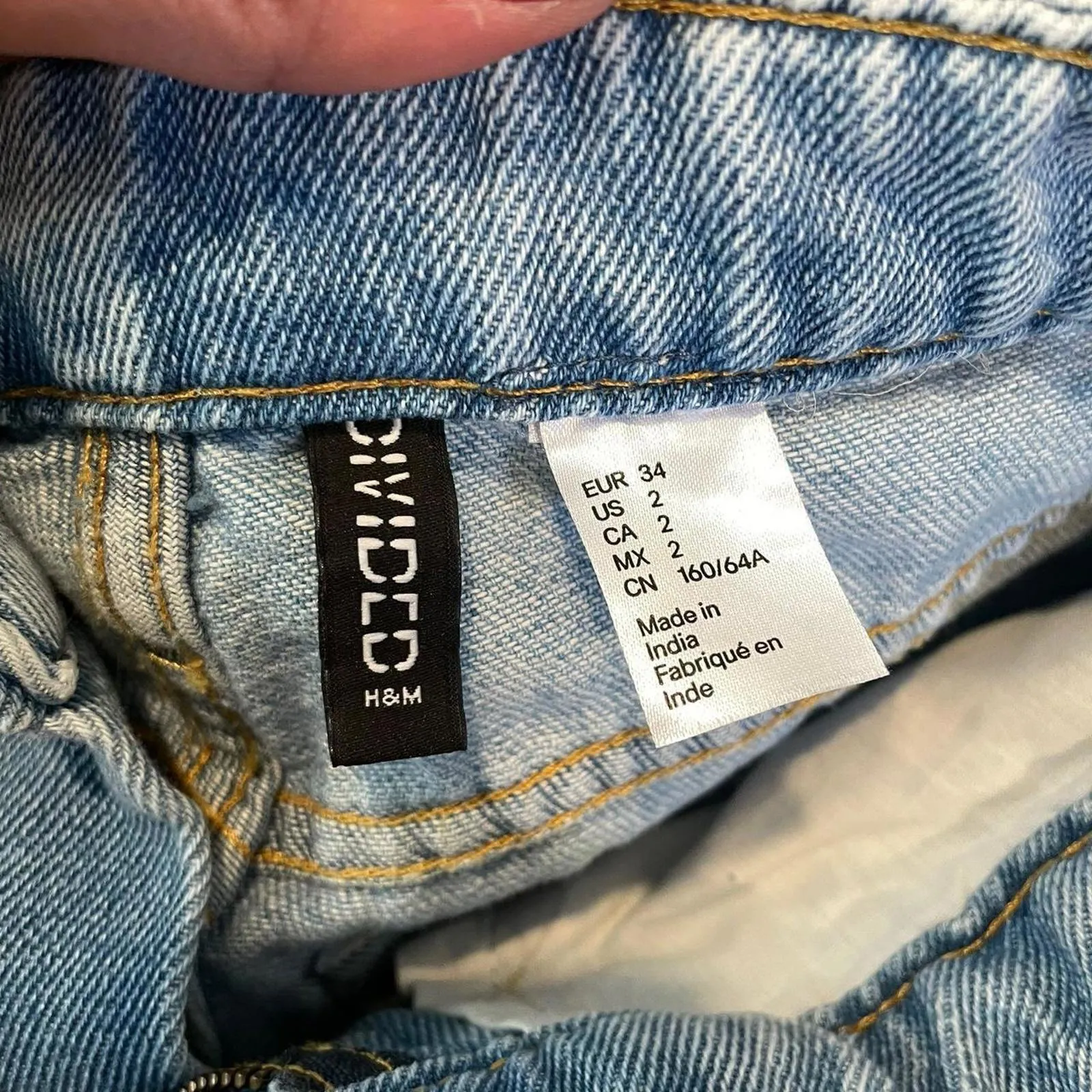 High-waisted, light-wash denim jeans with rips at the knees from h&m. size 2 - Image 4