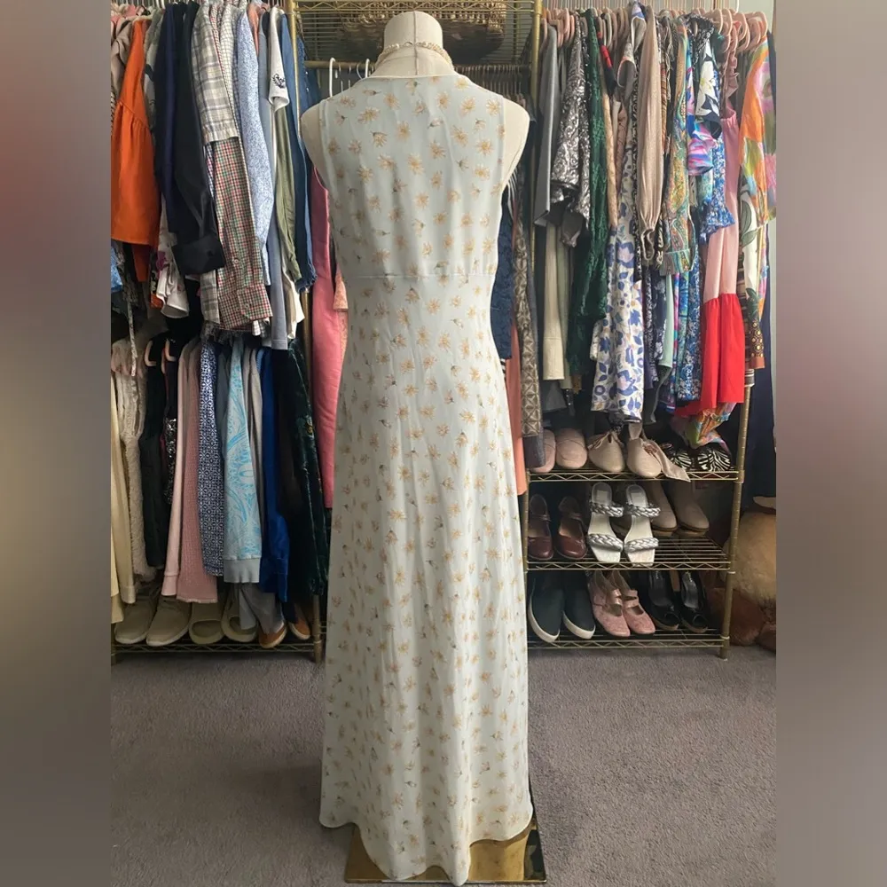 Long Dress: Elegant 90’s sleeveless dress features A-line silhouette, perfect for any occasion. The delicate fabric drapes beautifully, providing a flattering fit. This timeless piece can be dressed up or down, making it a versatile addition to your wardrobe. Ideal for summer gatherings or evening events, it's a must-have for style enthusiasts. - Image 2