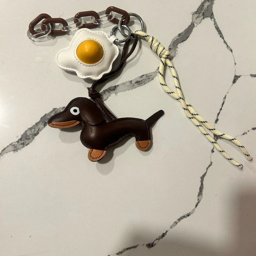 Brown Dachshund Keychain with Egg Charm
Faux leather - Image 3