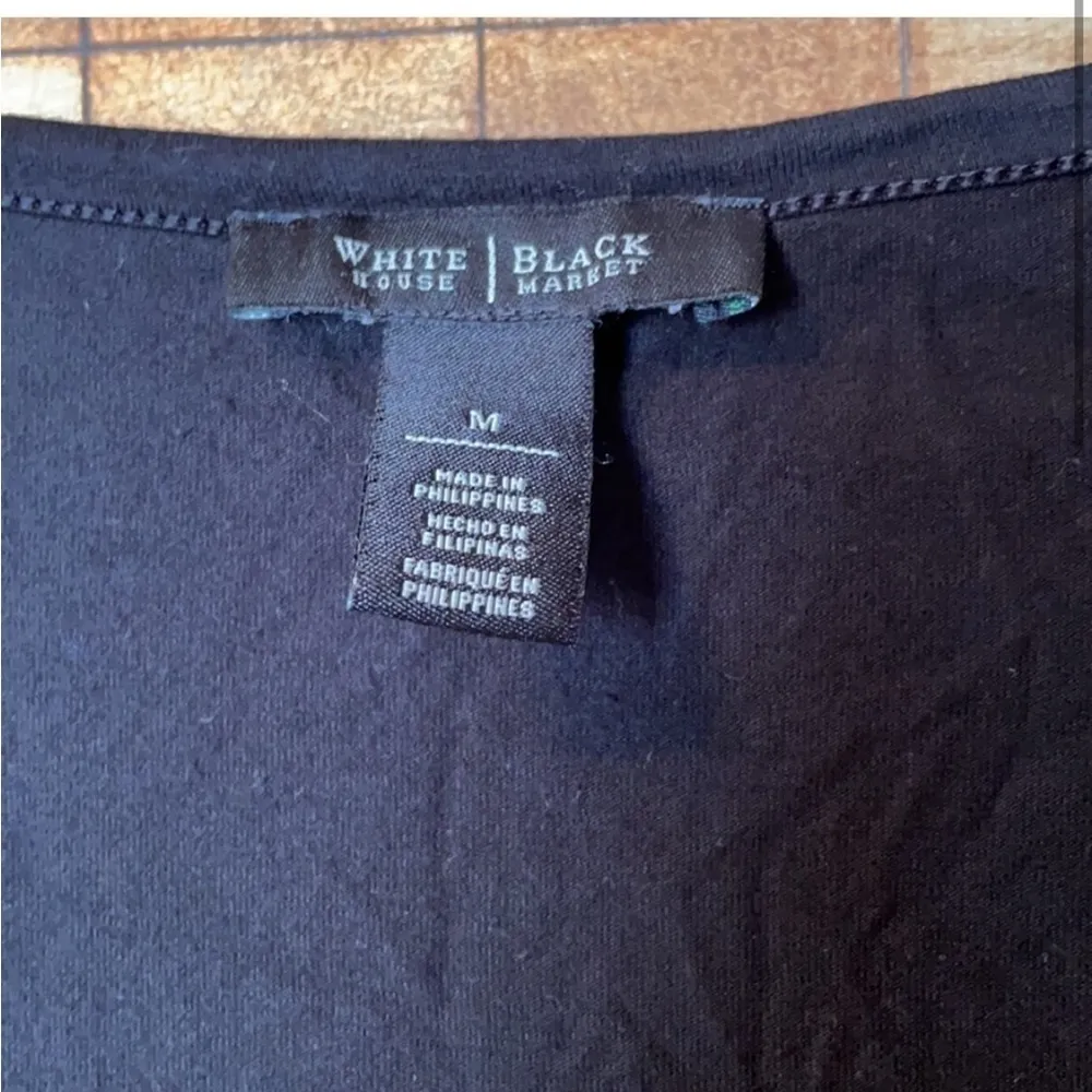 WHBM pearl button long sleeve black top. Size M - Image 2