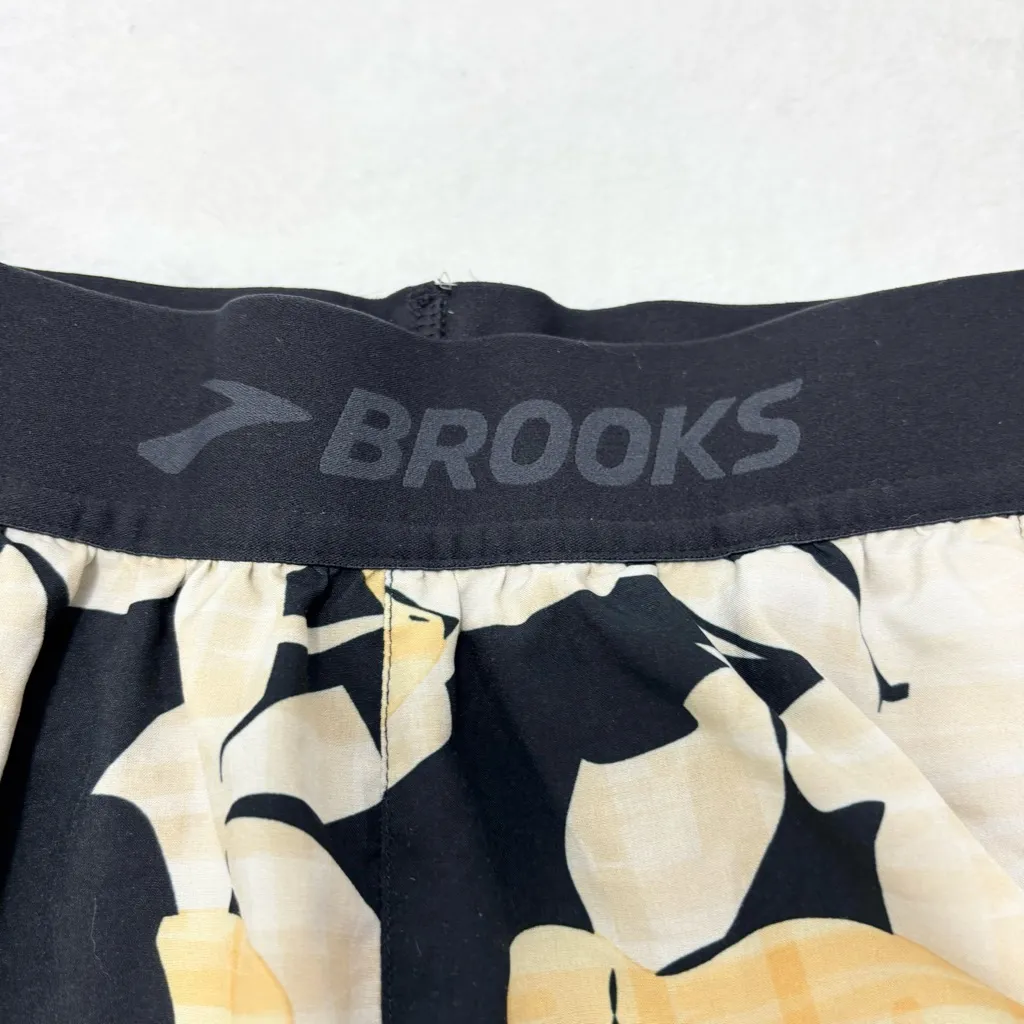 Brooks Women's Athletic Shorts with Black and Yellow Floral Pattern size S - Image 4